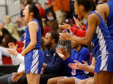 Allen’s Maggie Chen, cheers from the bench alongside her teammates during a district 5-6A...