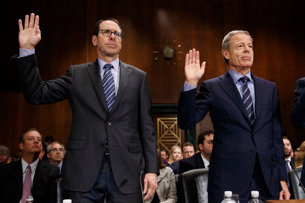 AT&T Chairman and CEO Randall Stephenson, left, and Time Warner Chairman and CEO Jeffrey...