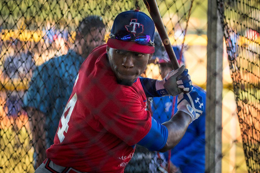 Cuban outfield Julio Pablo Martinez hits in the batting cage during a tryout camp at the...