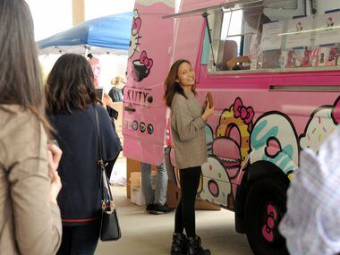 Winona Deng makes her purchase at the window at the Hello Kitty Cafe Truck at The Shops at...