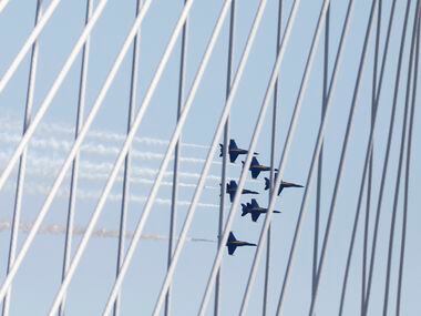 The U.S. Navy Blue Angels, shot through The Margaret Hunt Hill Bridge, fly over the Dallas...