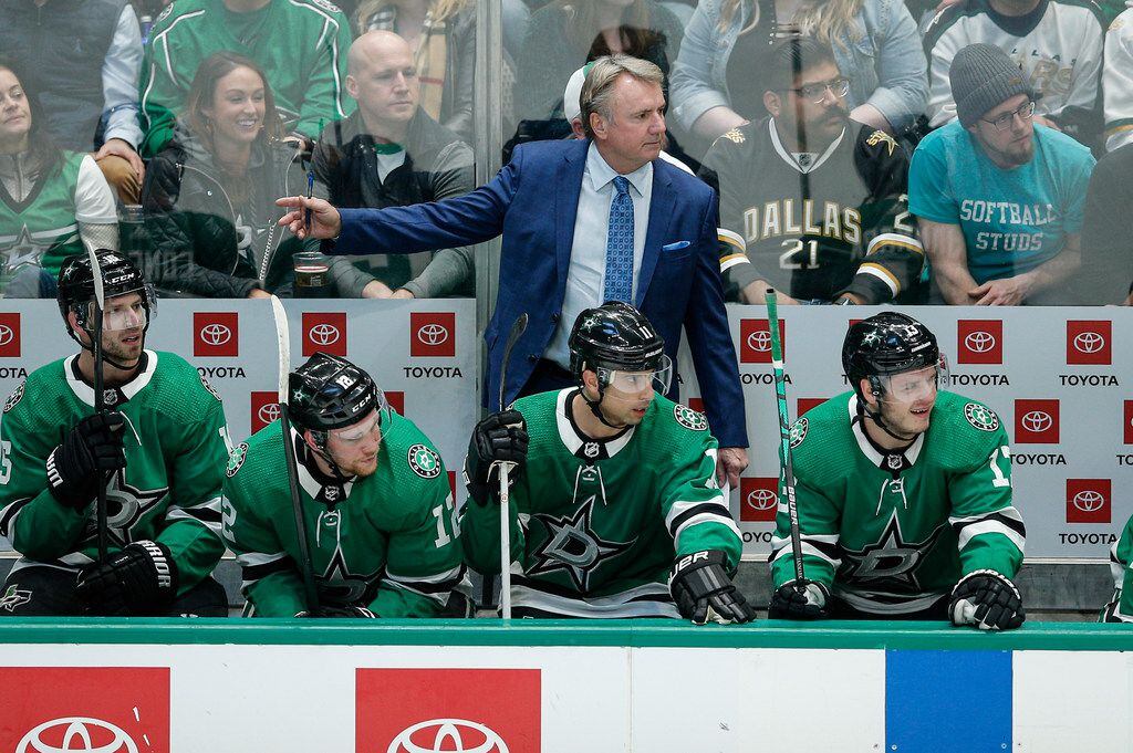 Dallas Stars interim head coach Rick Bowness looks on from the bench during the first period...
