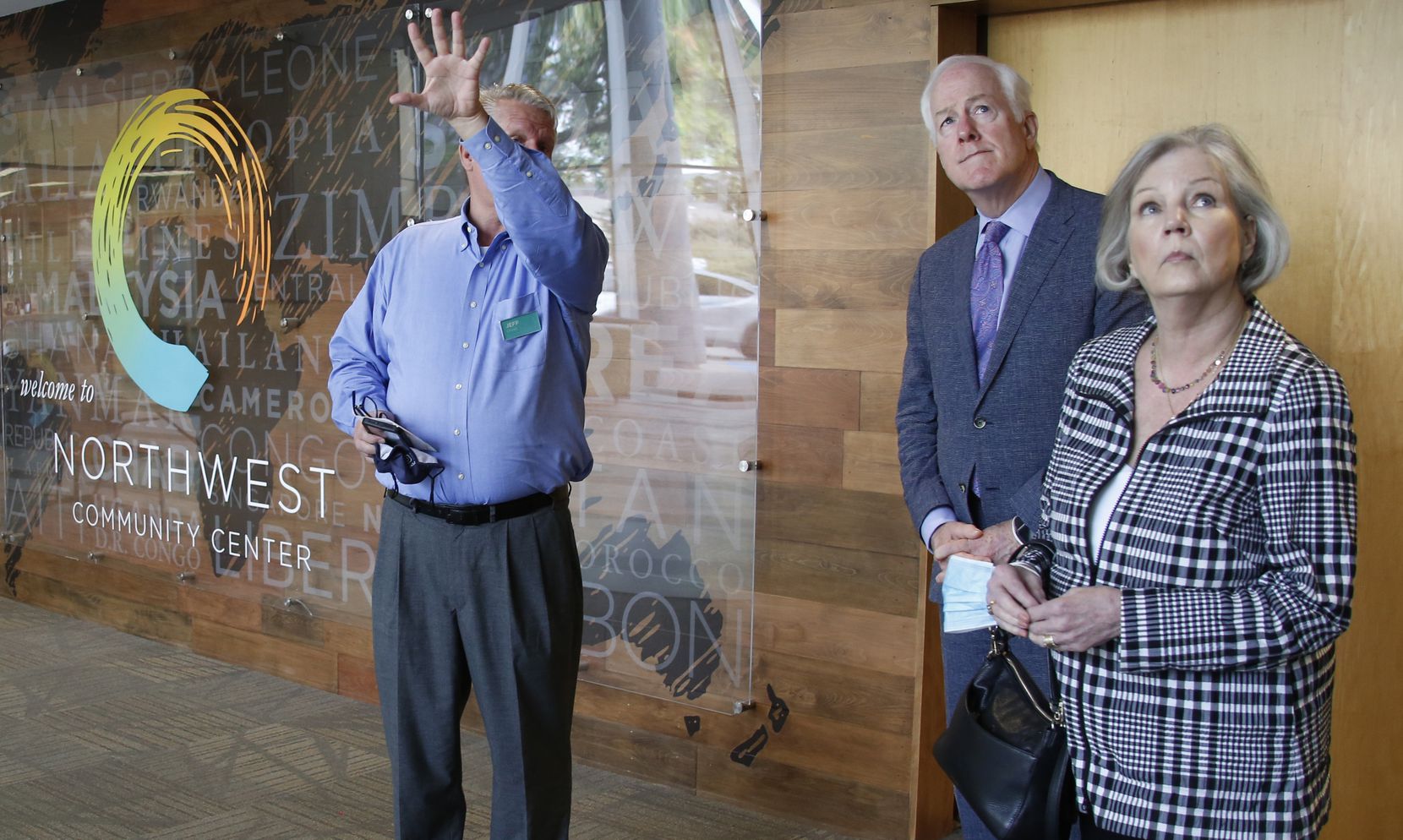 U.S. Senator John Cornyn and wife Sandy, right, listen during a tour of the non profit...
