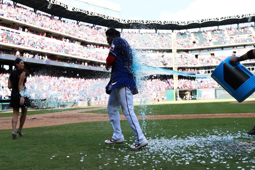 Texas Rangers shortstop Elvis Andrus (1) gets doused with Powerade following a MLB game...