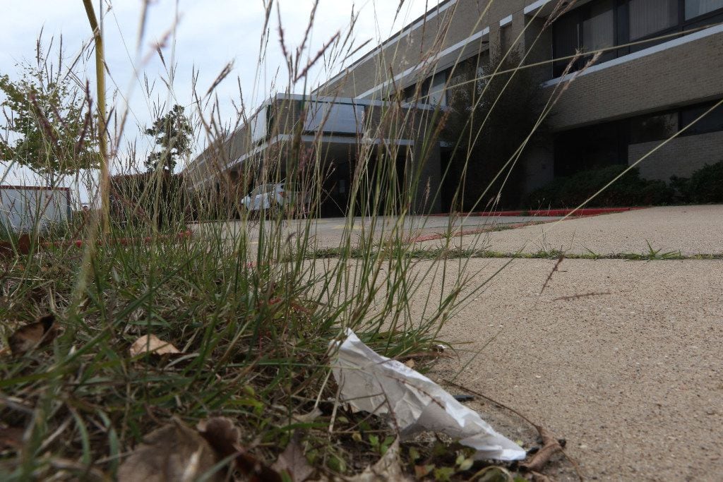 Weeds and trash cover the lawn of the rundown former Cleveland Regional Medical Center at...