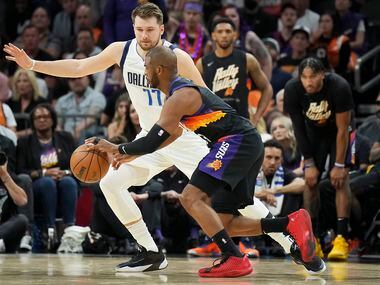 Dallas Mavericks guard Luka Doncic defends against Phoenix Suns guard Chris Paul during the...