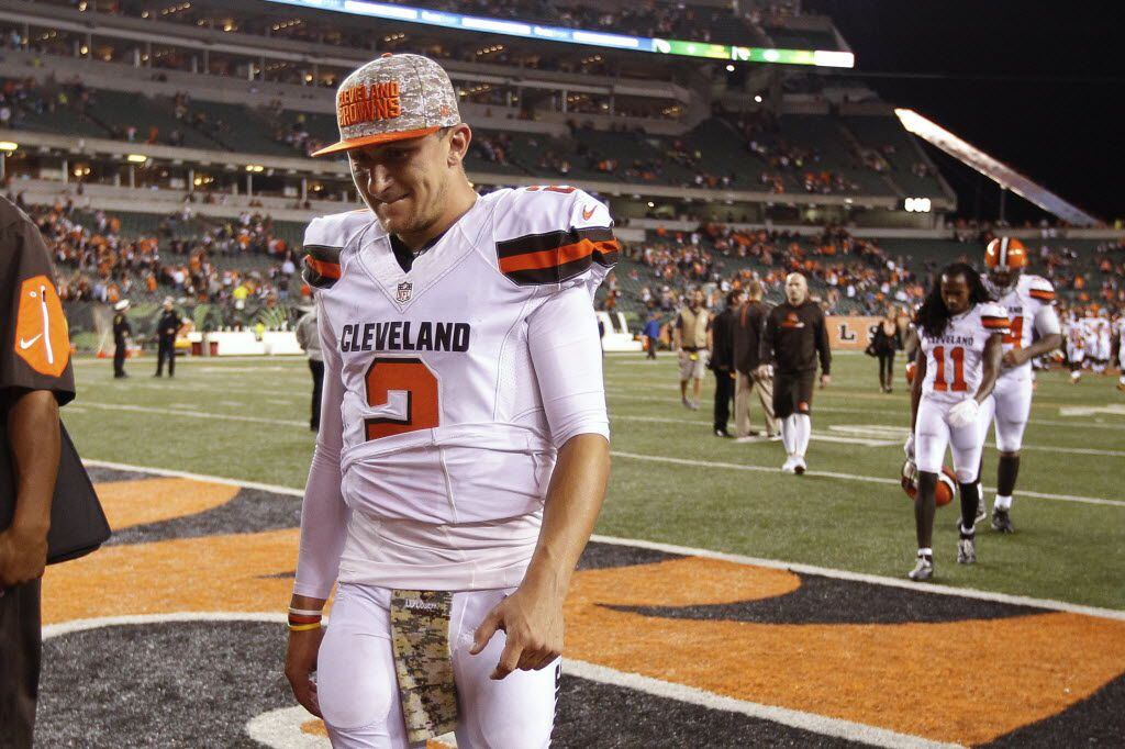 FILE- In this Nov. 5, 2015, file photo, Cleveland Browns quarterback Johnny Manziel walks...