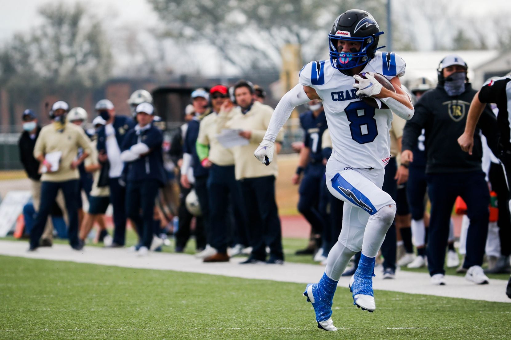 Dallas Christian's Parker Robertson (8) runs in a touchdown against Austin Regents during the first half of a TAPPS Division II state championship game at Midway's Panther Stadium in Hewitt on Saturday, Dec. 19, 2020. 