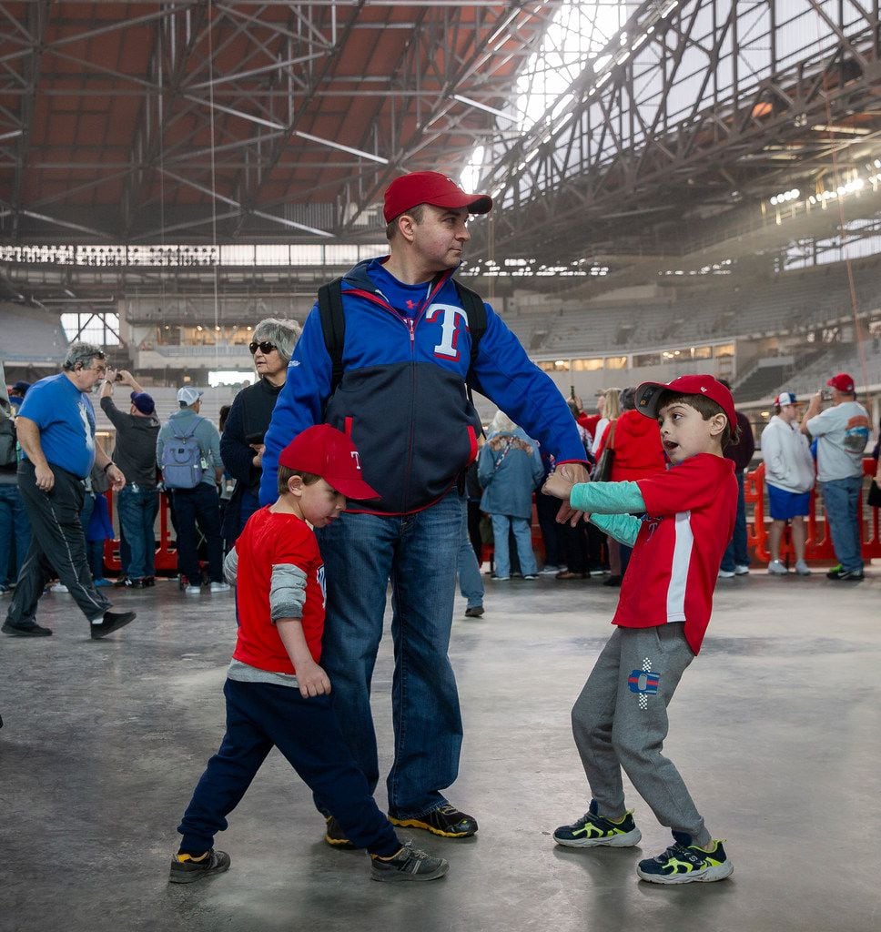 Robert Gillespie from Fort Worth and his sons, Samuel, 6, and Rafael, 4, check out the Globe...