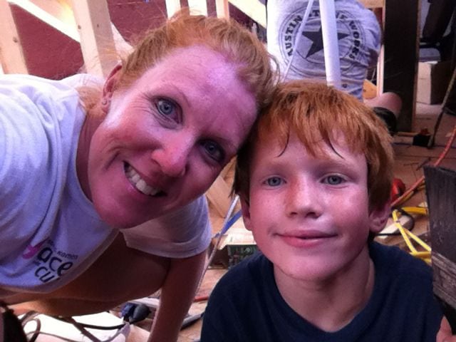 April Dyke with son Carson during their work helping to renovate a Texas A&M school bus into a tailgating bus for football games.