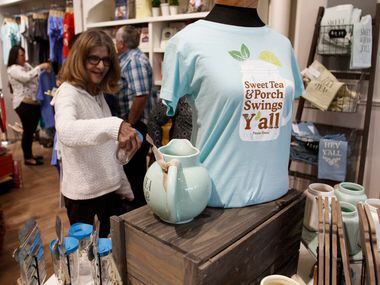 Donna Koch of Plano shops for items at the retail store inside Paula Deen's Family Kitchen...