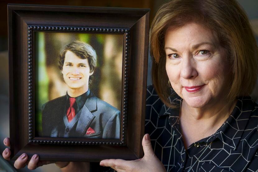 Vanita Halliburton holds a photograph of her son, Grant, at the offices of the Grant...
