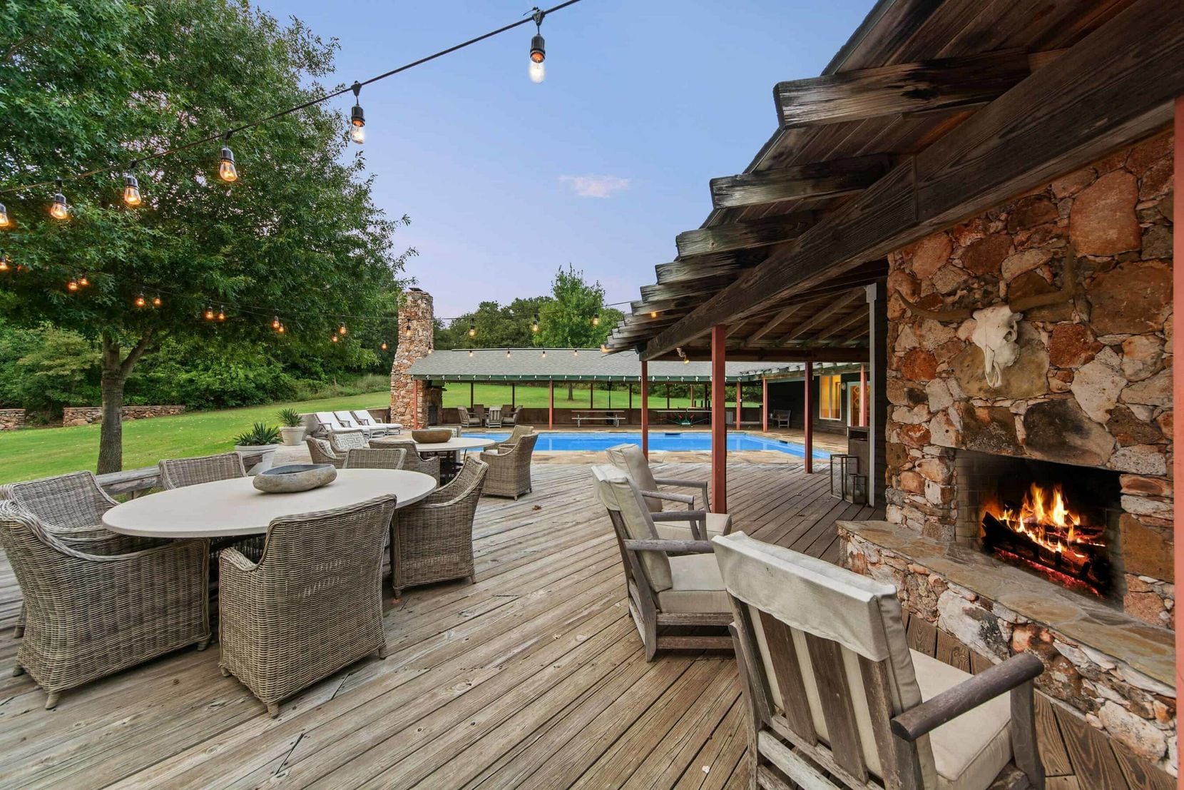 Patios and outdoor fireplaces surround the home at Prairie Oaks Ranch in Bowie.