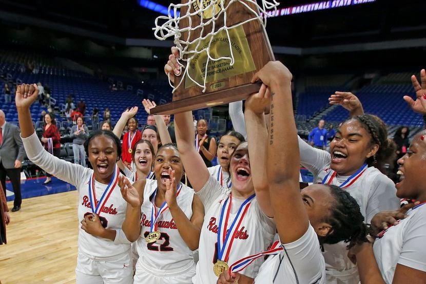 Frisco Liberty celebrates with their trophy after they defeated Lubbock Lubbock Cooper 57-52...