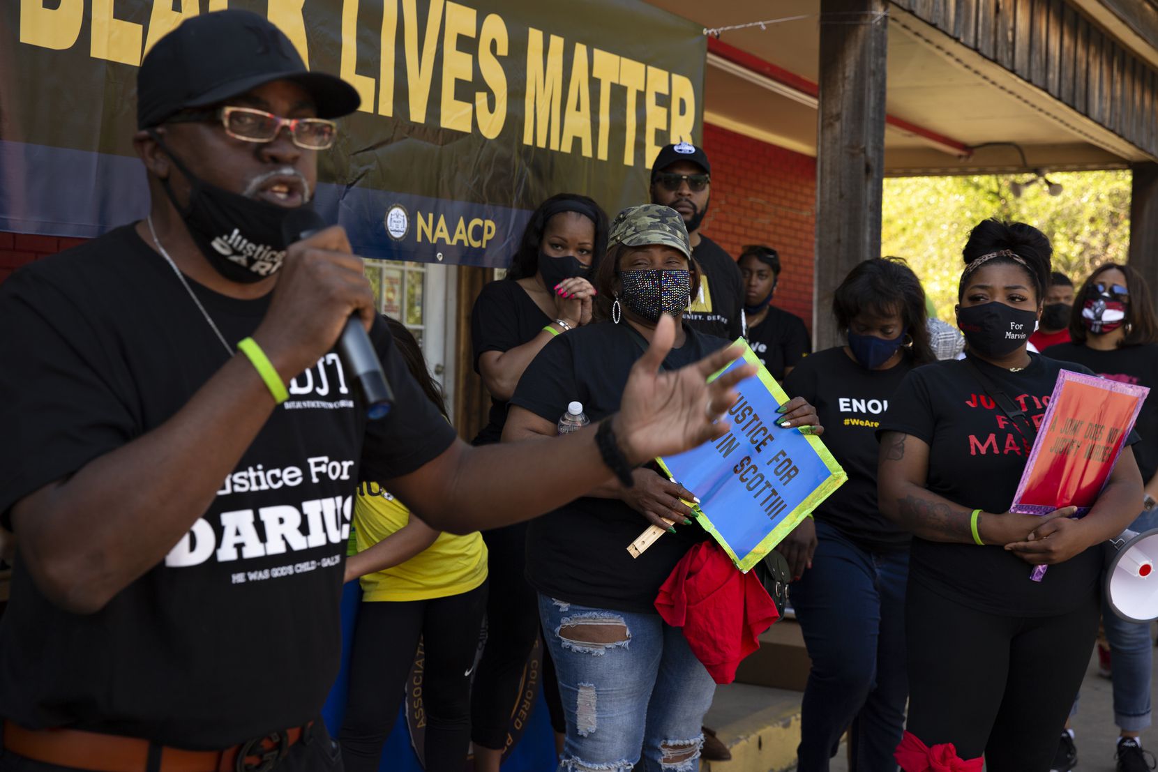 The families of Marvin Scott III and Rodney Reese listen to Kevin Tarver, father of Darius Tarver who was fatally shot by  Denton police, speak at a demonstration in Allen held by the Collin County NAACP advocating justice for Marvin Scott III on April 11, 2020.  (Shelby Tauber/Special Contributor)