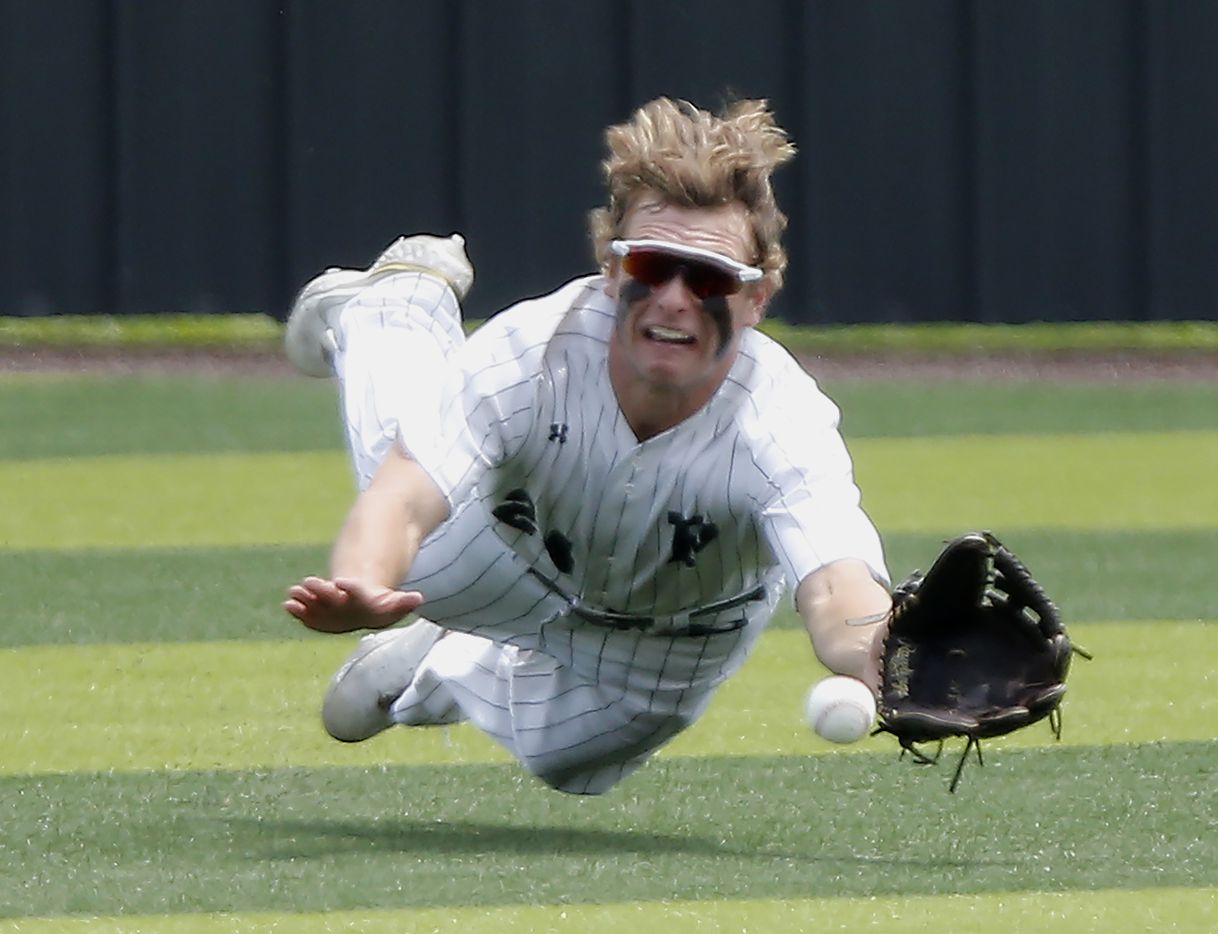 Prosper left fielder Jacob Devenny (24) was unable to make the diving catch in the fourth...