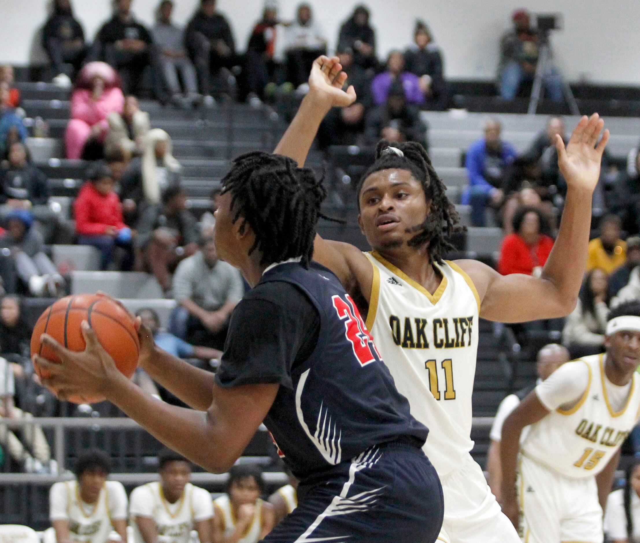 Kimball's Damarion Wickware-Wesley (24), left, looks to shoot against the defense of South...