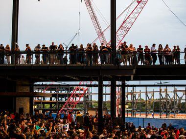 Guests watch Eleven Hundred Springs from the balcony of the Arlington Backyard venue during...