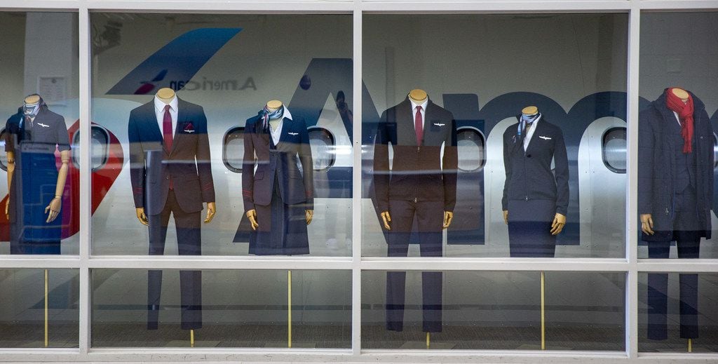 A display case features the newest collection of flight attendant uniforms at the new American Airlines campus and headquarters in Fort Worth, Texas, on Monday, Sep. 23, 2019. (Lynda M. Gonzalez/The Dallas Morning News)