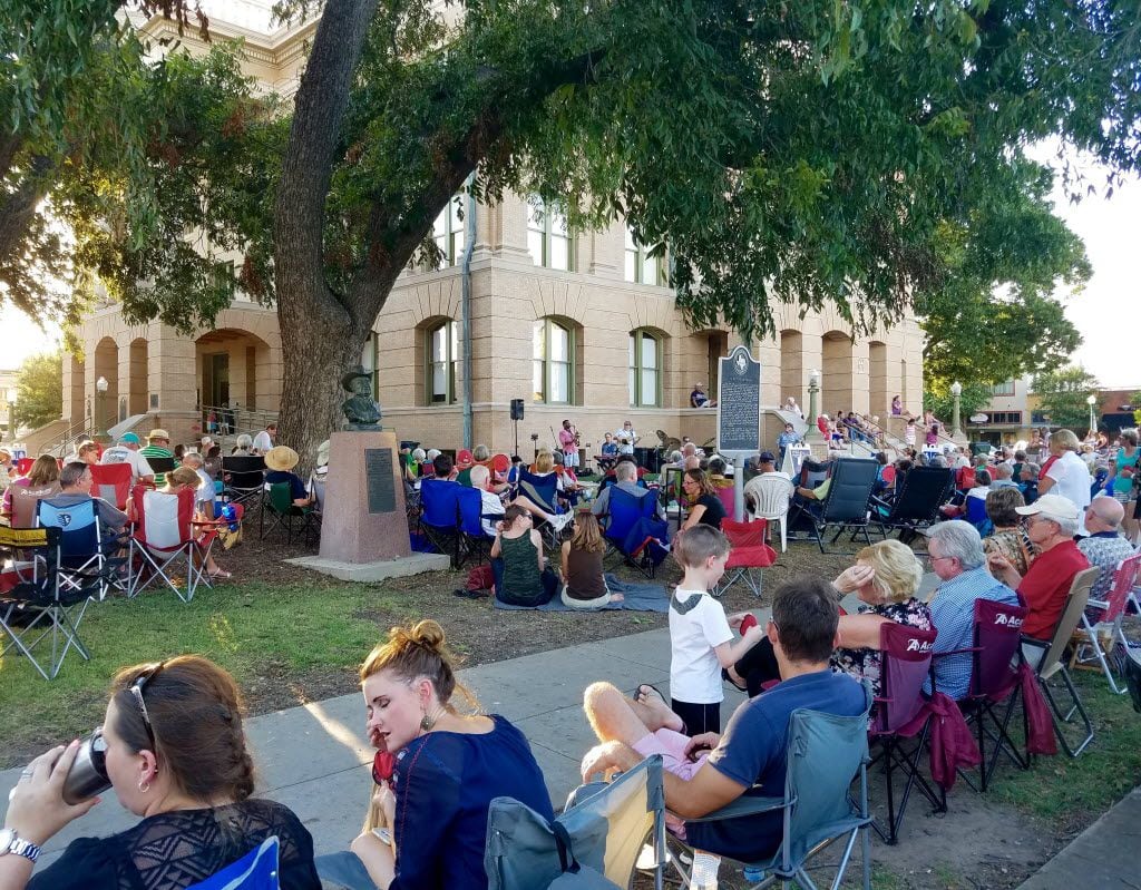 On an August Friday night, hundreds gather on the lawn of the Williamson County Courthouse...