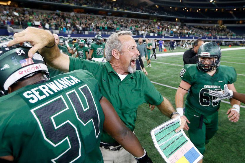 Richard Barrett celebrating with his players in 2017 after Kennedale defeated Stephenville...