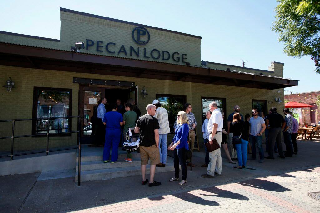 Diners wait in line to place an order inside the Pecan Lodge restaurant in Deep Ellum, on...