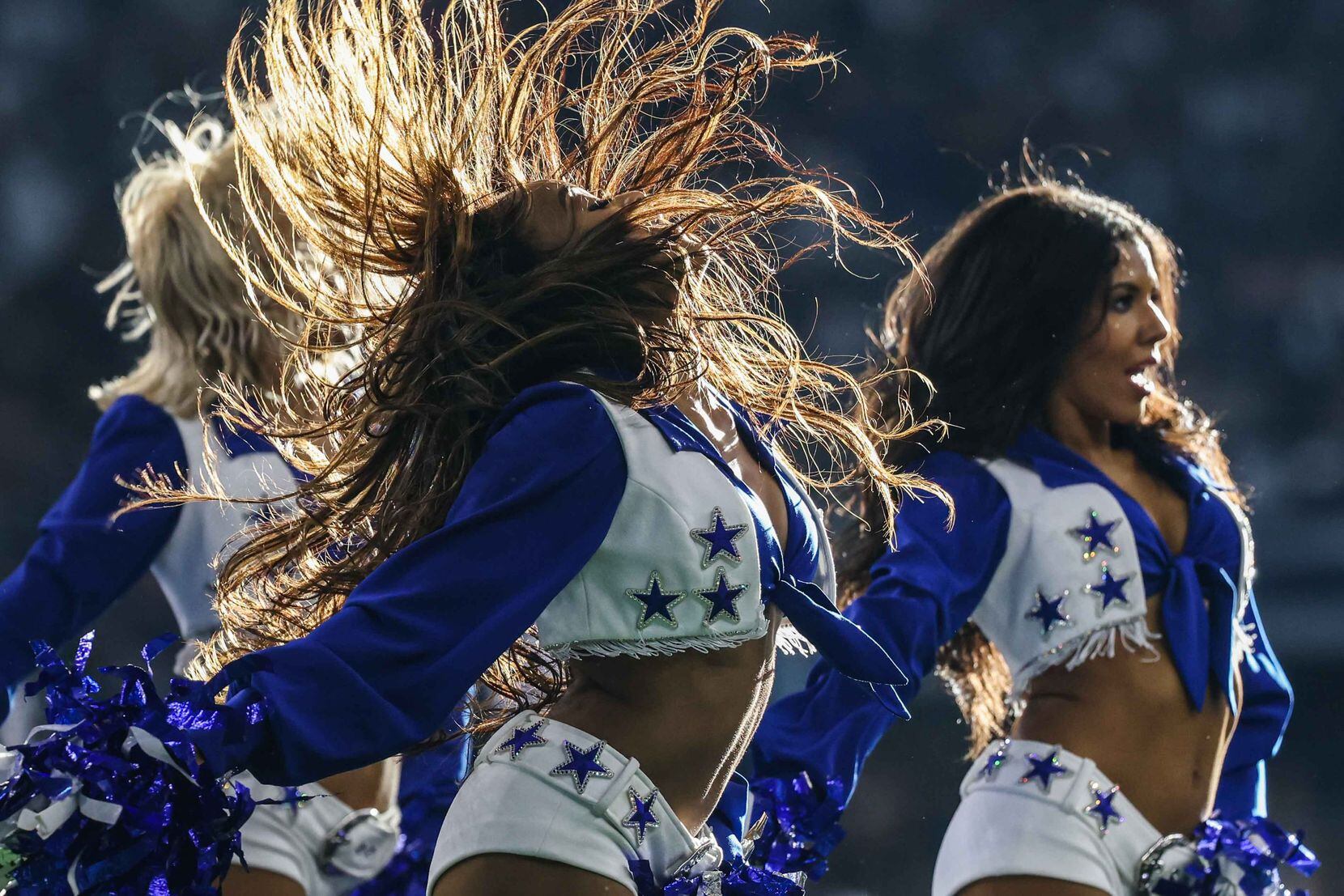 Dallas Cowboys' cheerleaders dance during the 4th quarter of the game against New York...
