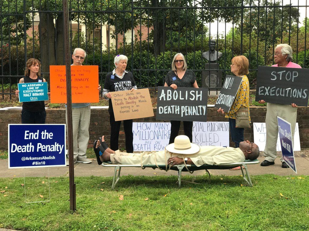 Pulaski County, Ark., Circuit Judge Wendell Griffen camps out on a cot at an anti-death penalty demonstration outside the Governor's Mansion in Little Rock. 
