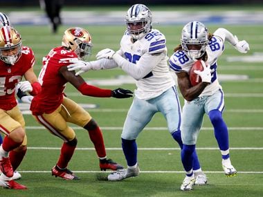 Dallas Cowboys wide receiver CeeDee Lamb (88) takes an onside kick and runs for a touchdown in the fourth quarter against the San Francisco 49ers at AT&T Stadium in Arlington, Texas on Sunday, Dec. 20, 2020. The Cowboys won , 41-33.