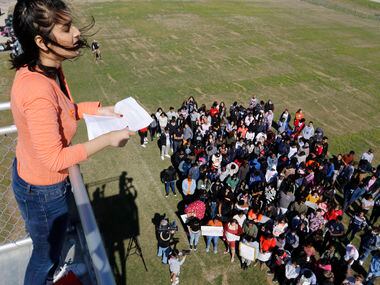 Frisco ISD Lone Star High School student, Hillary Shah, 17, leads the moment of silence in...