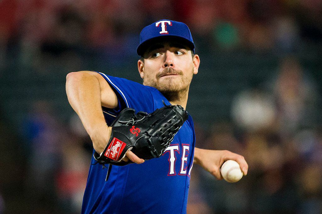Texas Rangers starting pitcher Matt Moore pitches during the third inning against the...