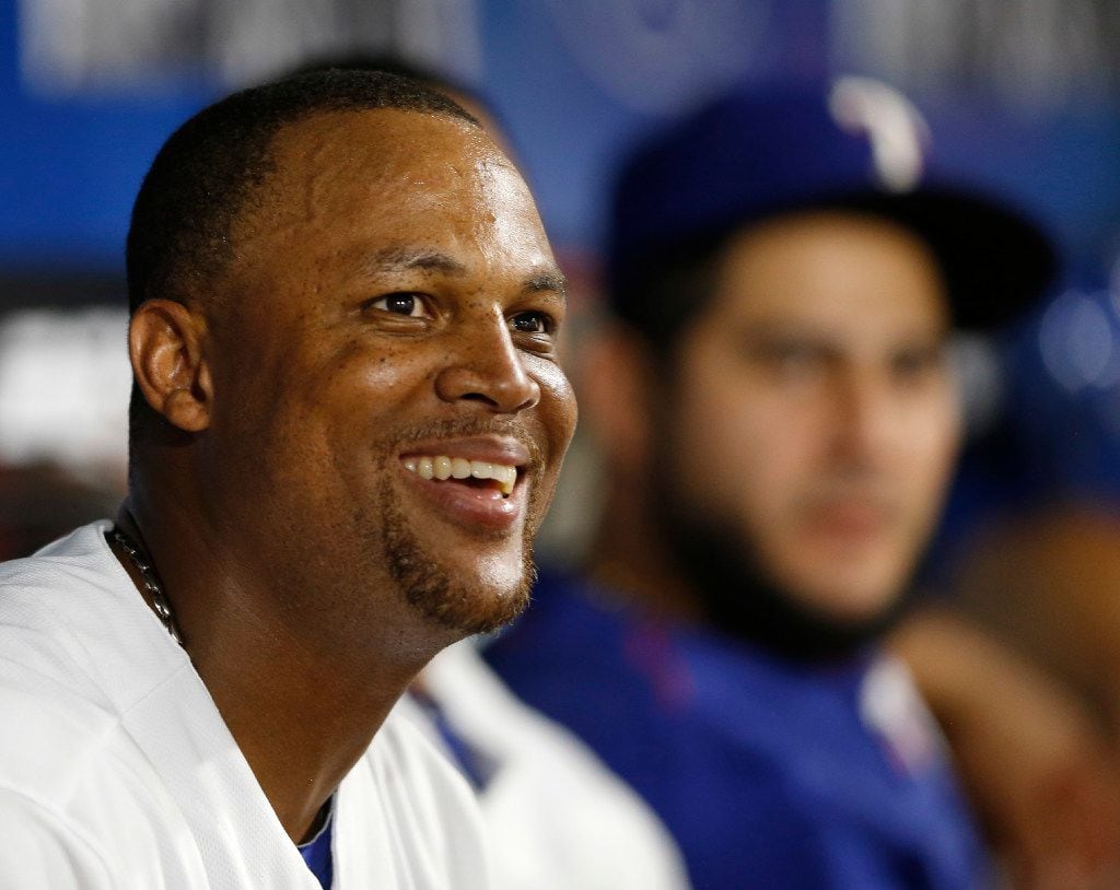 Texas Rangers third baseman Adrian Beltre (29) smiles as he looks at the big screen during...