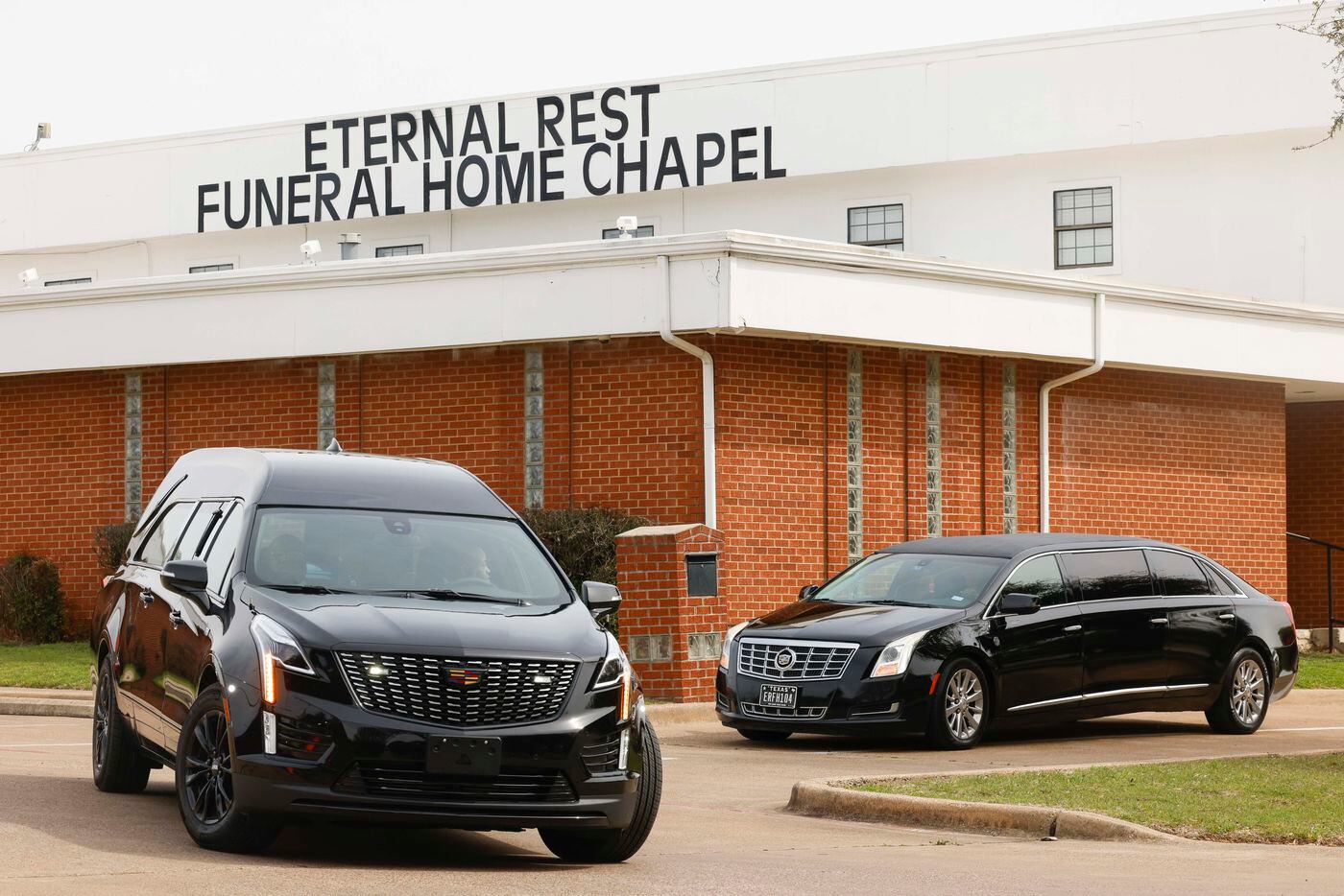 A hearse carrying late Legend Chappell takes the road after a funeral service on Saturday,...