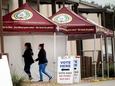 People arrive to the Tarrant County Elections Center to vote early in Fort Worth, Tuesday, October 27, 2020.