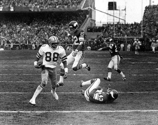 Dallas Cowboys receiver Drew Pearson, No. 88, catches the famous "Hail Mary" pass from Roger...