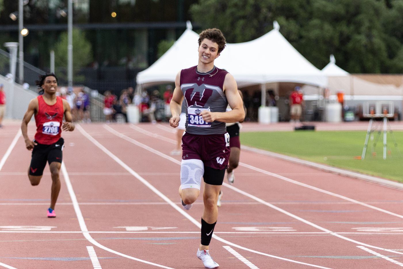 Logan Popelka reacts after crossing the finish line in the boys’ 400-meter dash at the UIL...