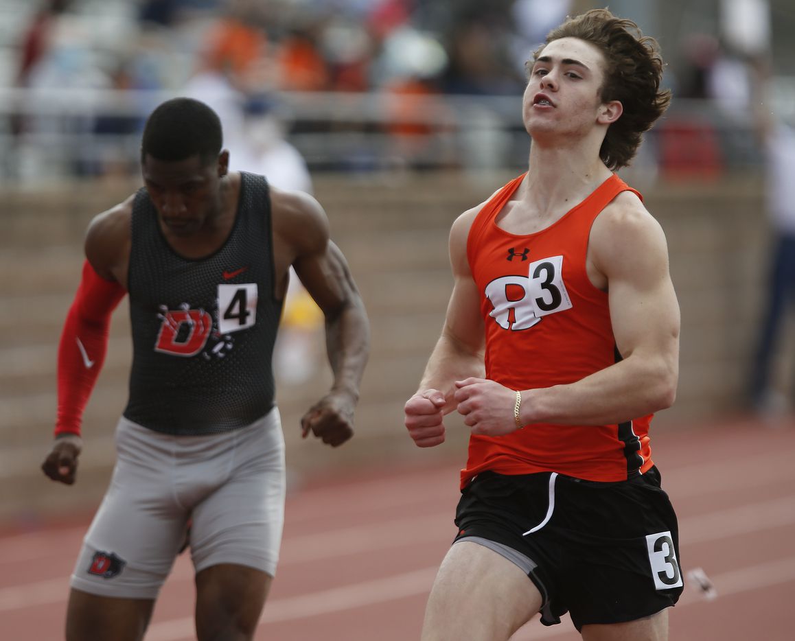 Brendon Ross (right), 15, of Rockwall High School, won his heat  of the boys 100 meters during the Jesuit-Sheaner Relays held at Jesuit College Preparatory School in Dallas on Saturday, March 27, 2021.  (Stewart F. House/Special Contributor)