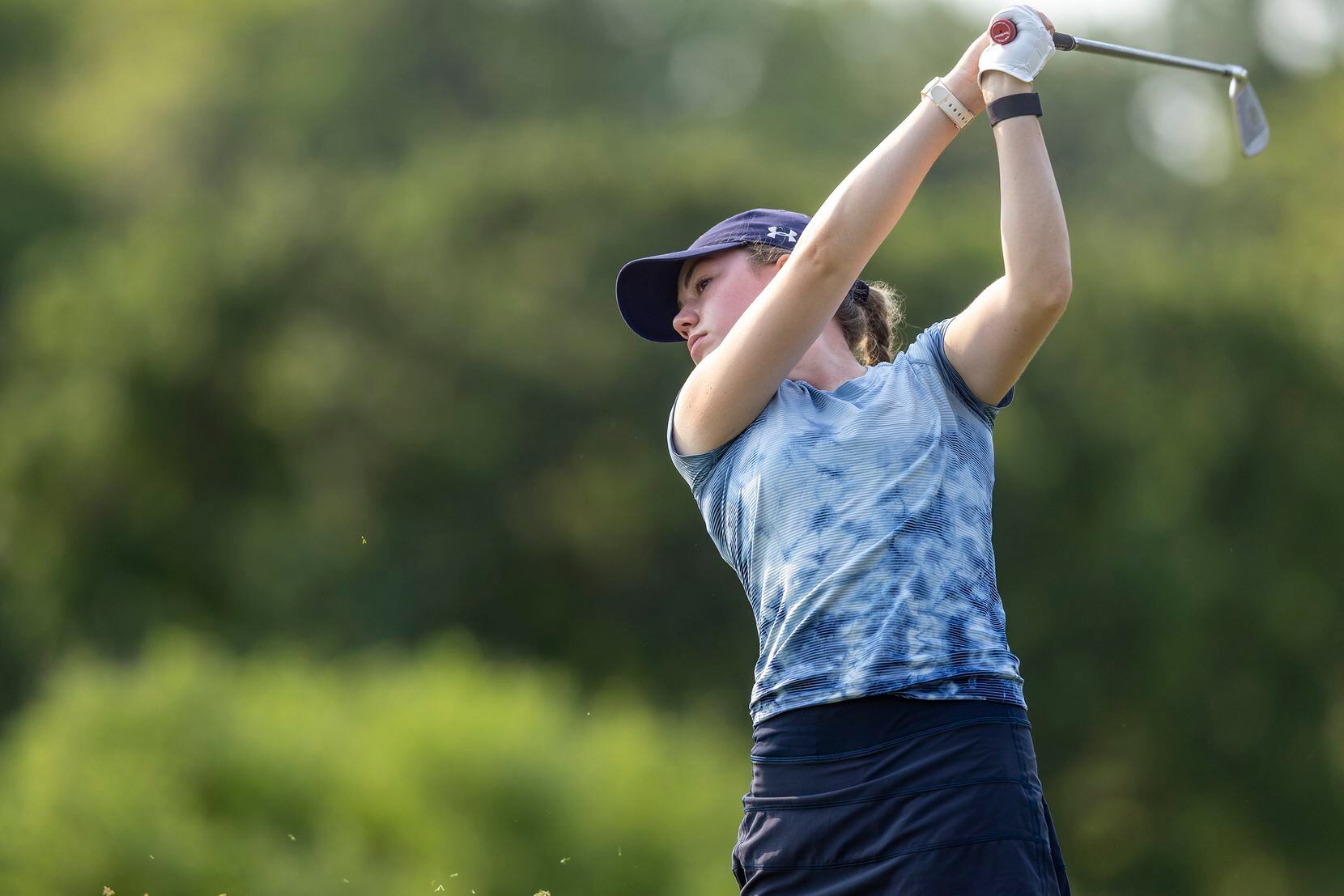 Highland Park’s Sophie Biediger hits from the 3rd tee box during the 5A girls state golf...