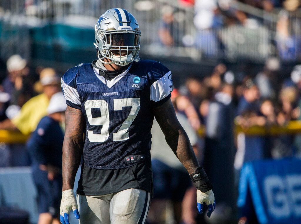 Dallas Cowboys defensive end Taco Charlton (97) smiles during an afternoon practice at...