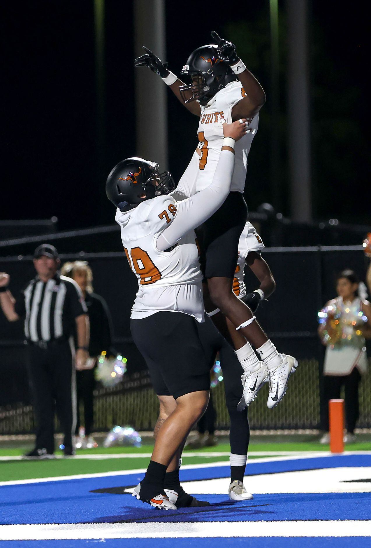 W.T. White wide receiver Demetrious Troupe (8) celebrates with offensive lineman Willie...