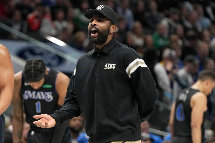 Dallas Mavericks guard Kyrie Irving questions a call during the first half of an NBA...