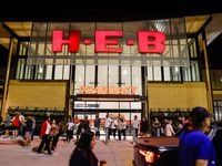 People wait outside the new H-E-B store set to open at 6AM in Frisco on Wednesday, Sept. 21,...