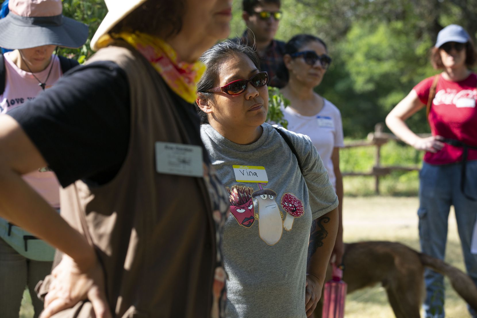 Vina Galindo (center), wears a custom made fungi shirt during the North Texas Mycological...