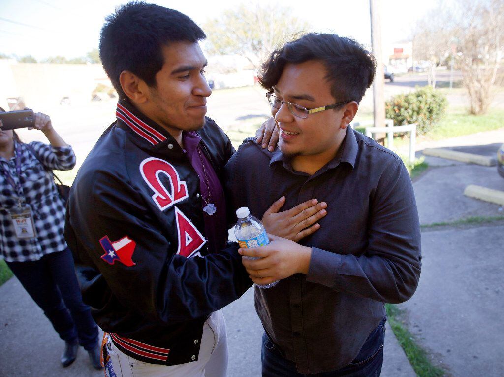 Edwin Romero, a Mexican immigrant with DACA, gets a hug from his friend Roy Ferretiz at a...