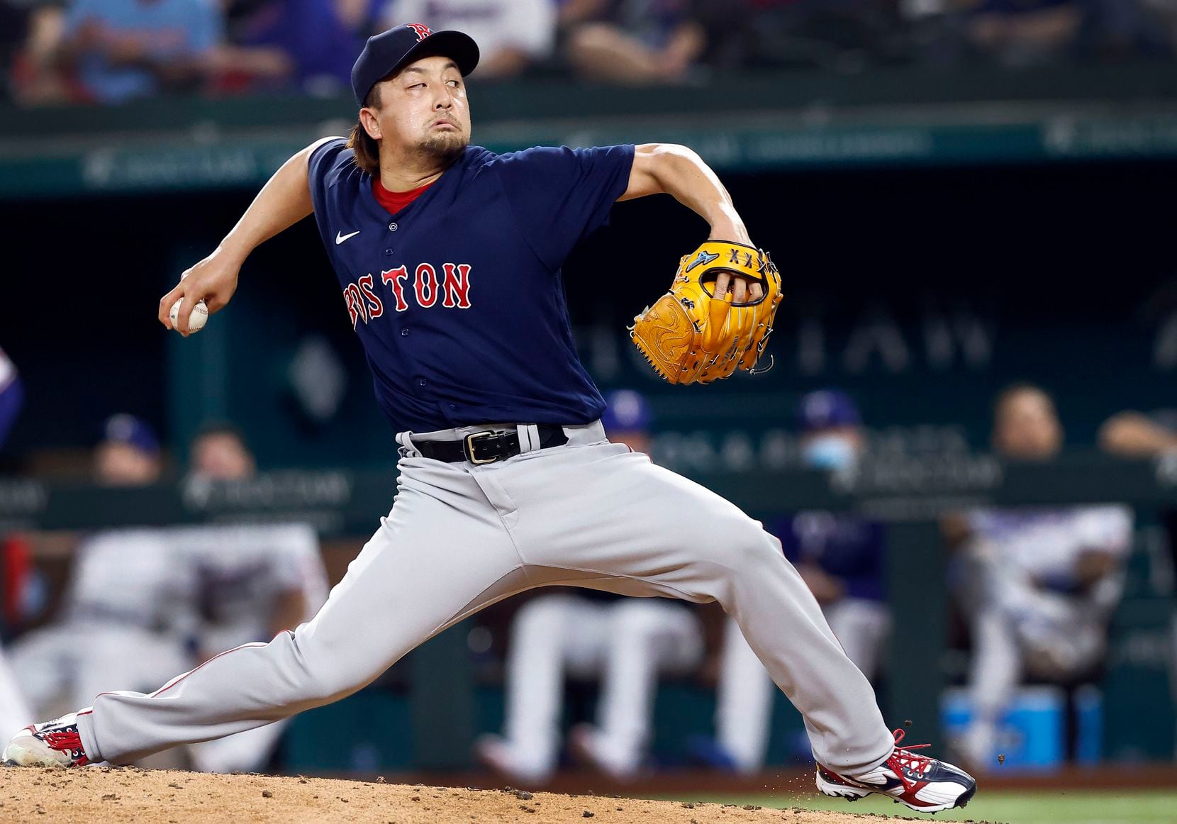 Boston Red Sox relief pitcher Hirokazu Sawamura (19) throws a home run pitch to Texas...