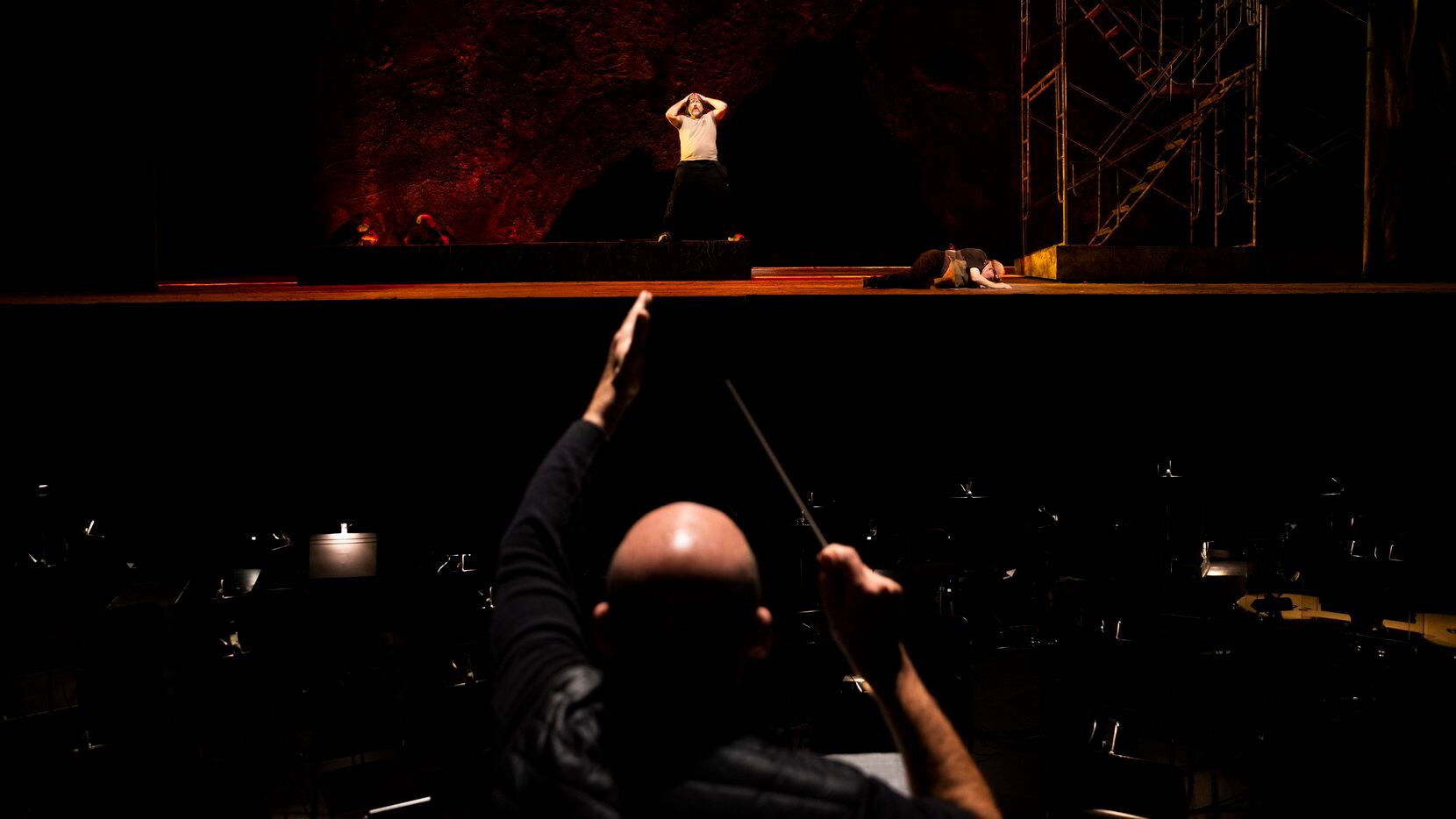 Baritone Michael Mayes performs as music director Emmanuel Villaume conducts during a...