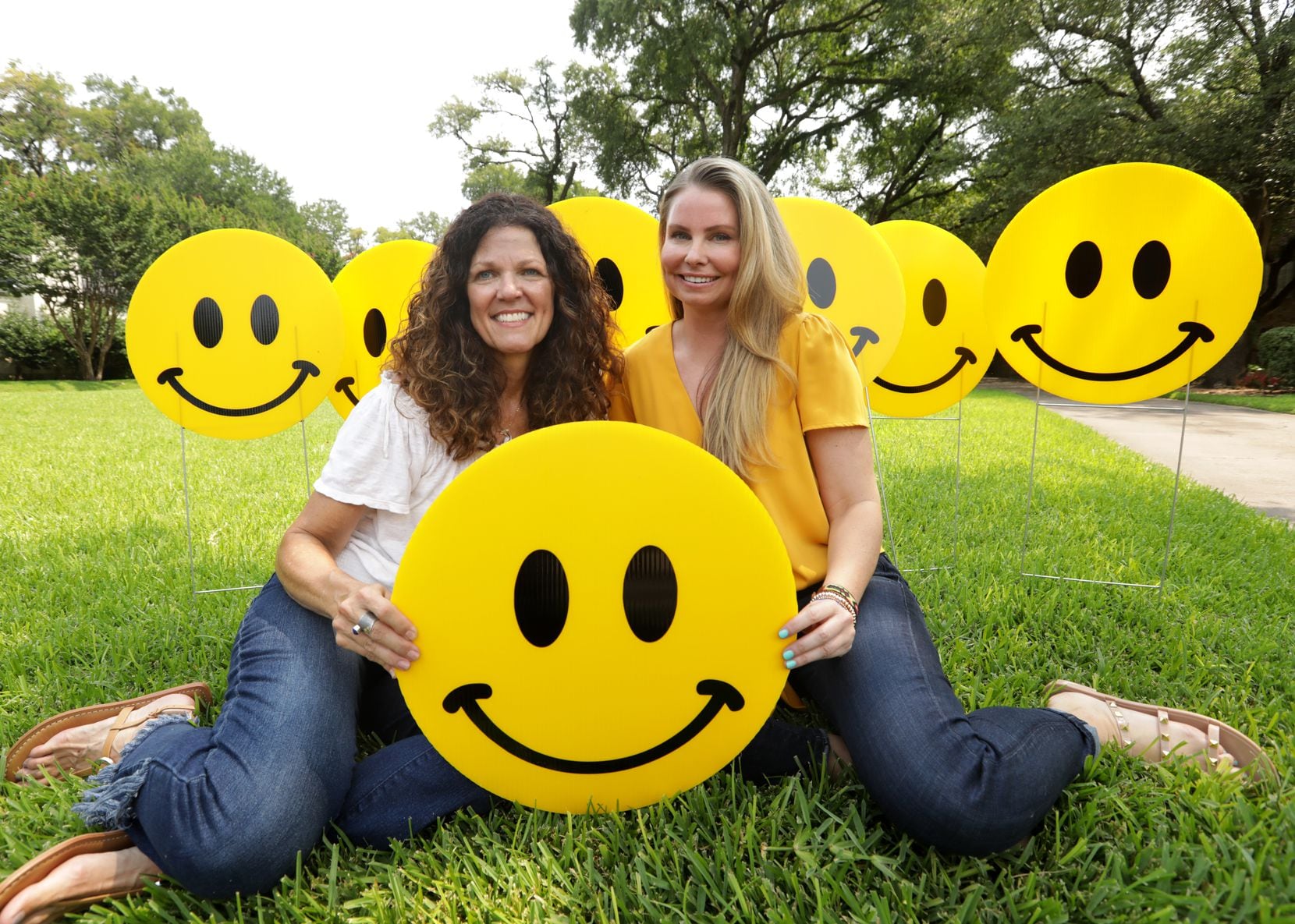 Joanie Curry (left) and Chelsea Davenport bonded over the power of a smiley face to brighten people’s day.