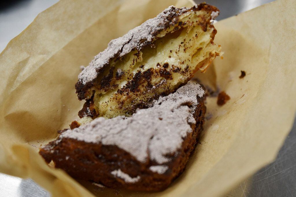 A chocolate powdered beignet from the new coffee and beignets shop, Le Bon Temps, in Dallas,...