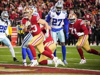 San Francisco 49ers running back Christian McCaffrey (23) scores on a 2-yard touchdown  run...