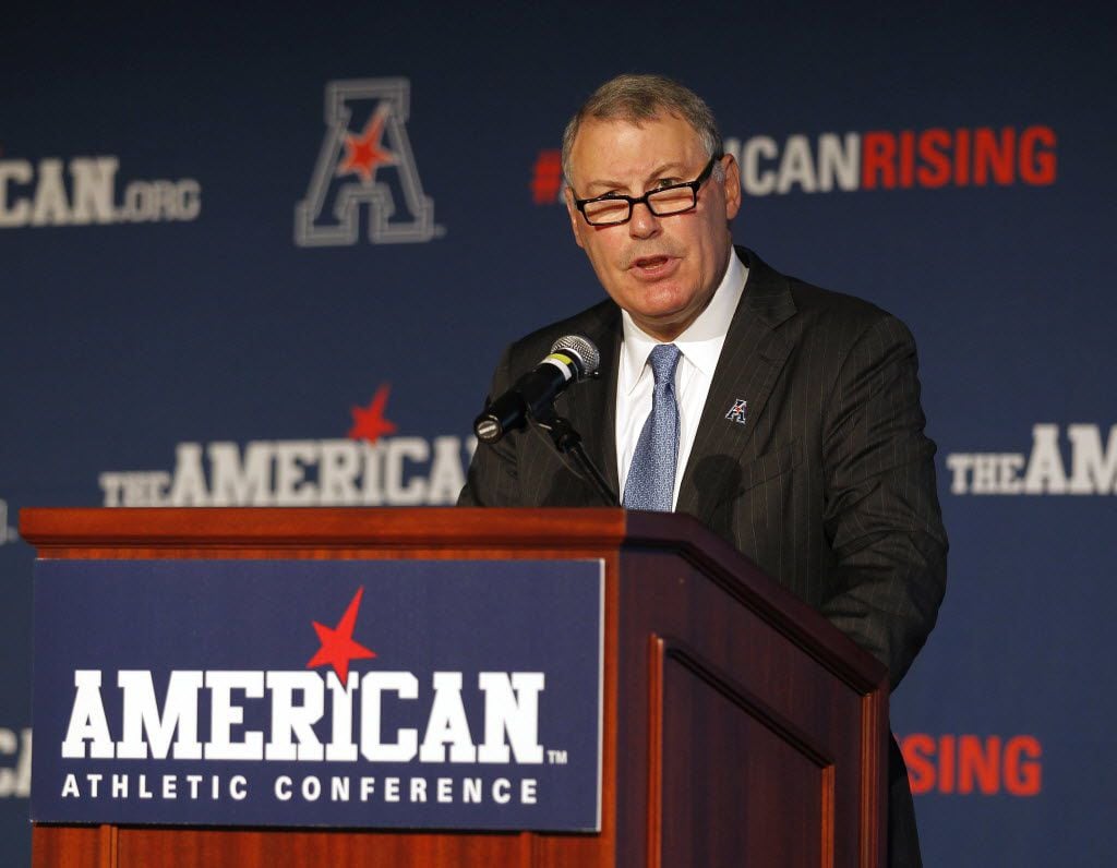 FILE - In this Aug. 4, 2015, file photo, American Athletic Conference Commissioner Mike...